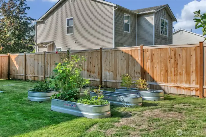 Gardening made easy with raised garden beds, ready for your favorite flowers or fresh produce.