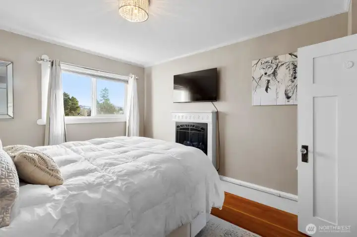 Spacious primary bedroom with classic character