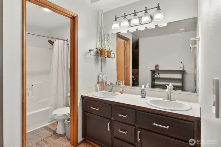 Double sink in primary with private showering area.