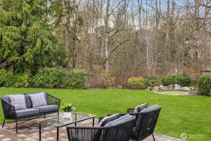 Patio with seating. Garden space for your green thumb.