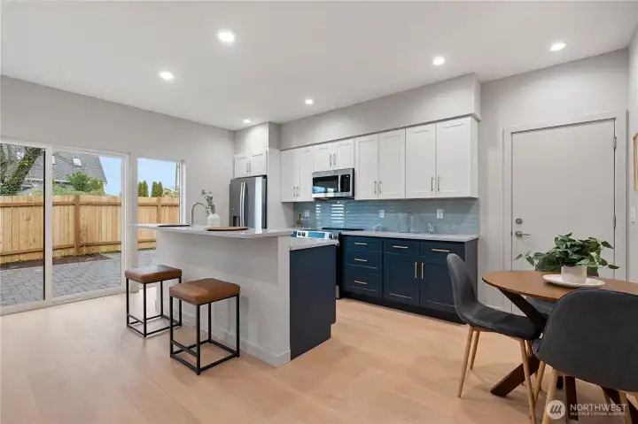 Full size kitchen with plenty of storage, quartz countertops, and stainless steel appliances.