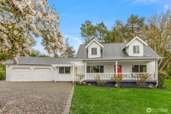 Charming Cape Cod home in Mountain Meadows, with a lovely verdant outlook.