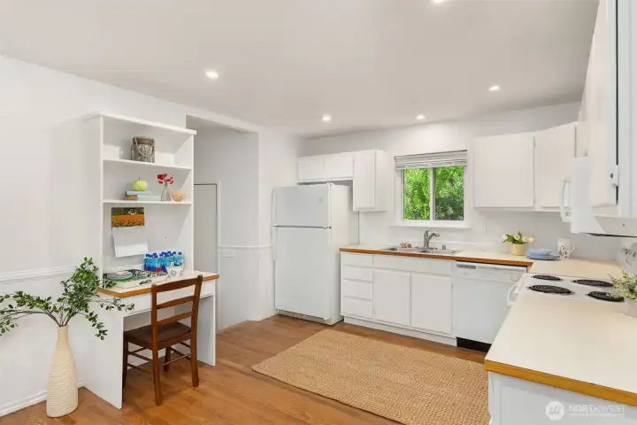 The hallway leads to the garage and has a walk-in pantry.