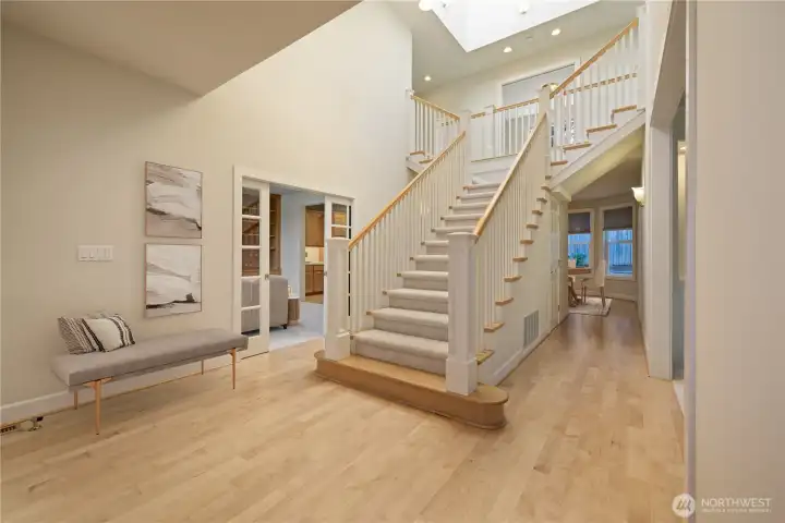 Front entry way as you walk through front doors (Remember to look up at the large skylight/lightwell positioned above the primary staircase!)