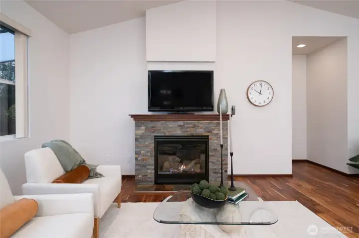Cozy fireplace and vaulted ceilings