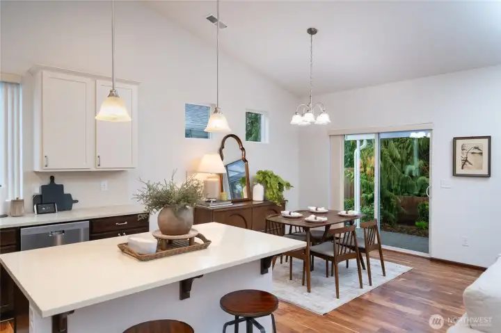 Open kitchen and dining with patio access