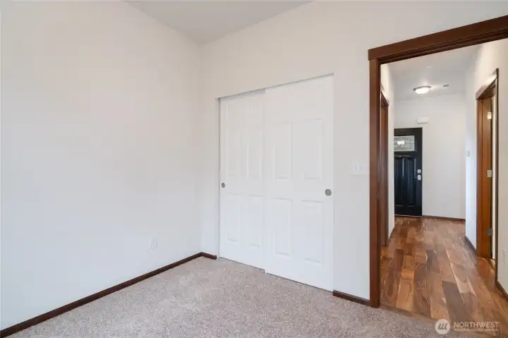Bedroom with closet and hallway view