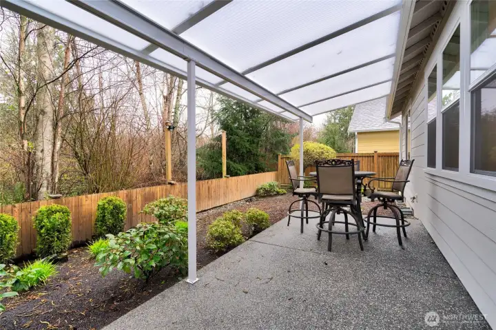 Covered patio with outdoor dining space