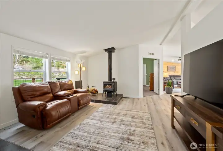 Living room just off of the entrance, wood burning stove heats the whole house