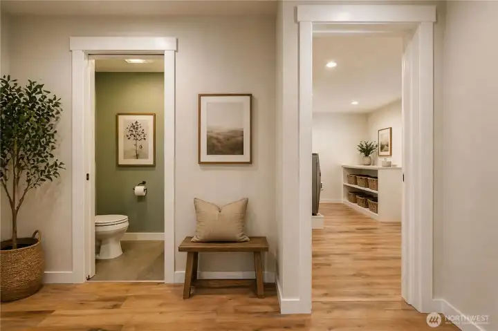 ½ bathroom on the left and laundry room to the right.