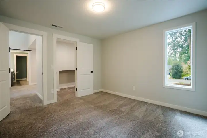 Bedroom #1 looking back at the door. Other door is a walk-in closet