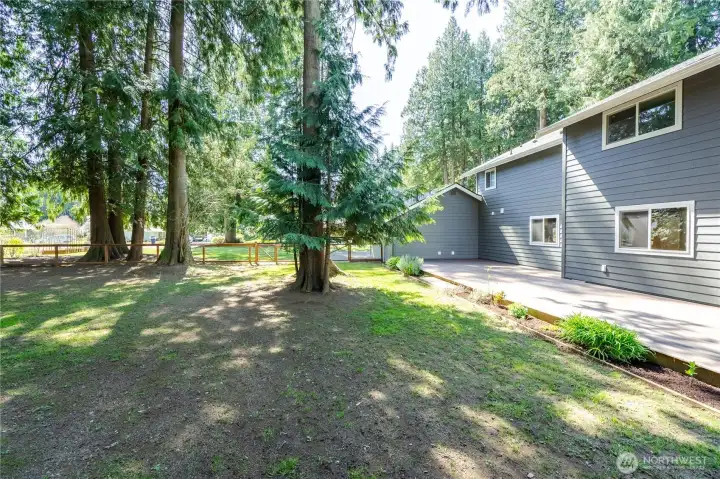 East side of the house. Tons of space and has a fully fenced back yard.