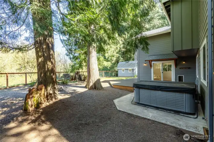 Beautiful backyard backing to the Bertrand Creek and Bertranda Reserve Yes the hot tub is included.