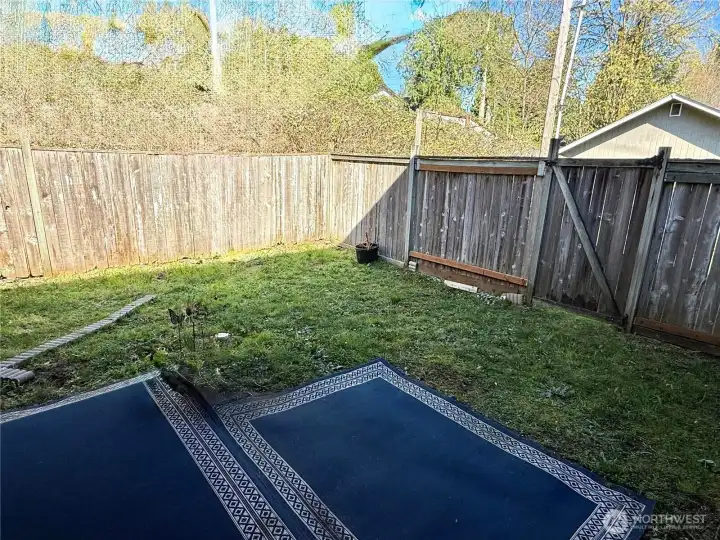 Covered porch and fenced in backyard for each unit.