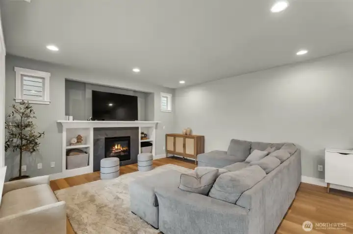 Spacious living room, with custom built ins, and smurf tube for cord management