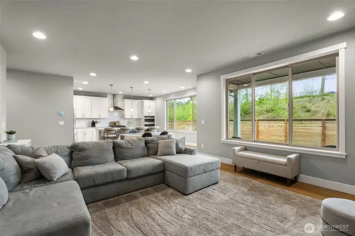 Spacious living room. Enjoy beautiful wood wrapped windows with scenic views