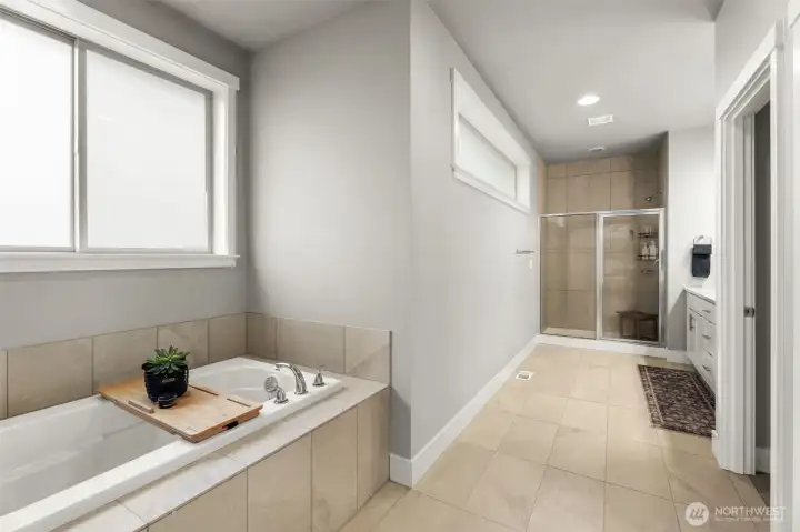 Spa inspired on suite, with soaking tub and walk in shower.