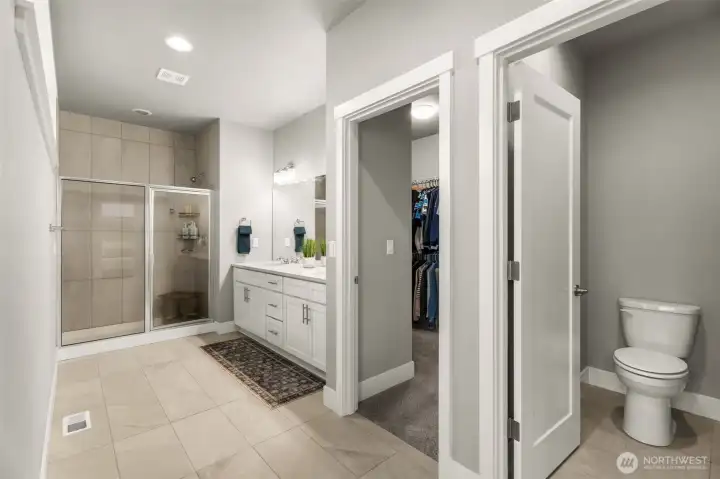Dual vanity sinks, with large walk in closet.. it just keeps going! and separate washroom closet.