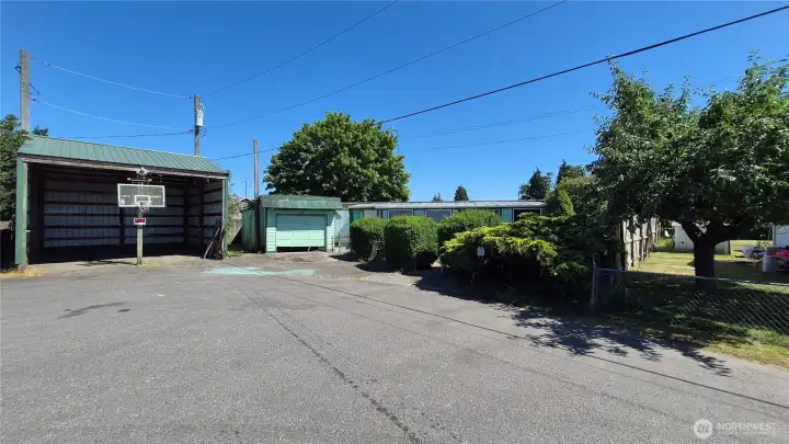 Includes this large RV parking garage + a regular 1 car detached garage.