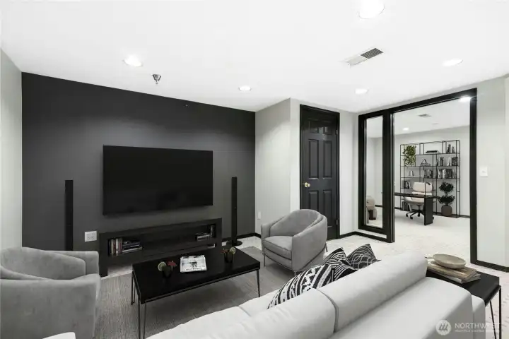 Virtually Staged - Finished lower-level flex space shown as a media room. Over 400 sq ft of additional finished space not included in the reported living area. Virtually Staged - Finished lower-level flex space shown as a media room. Over 400 sq ft of additional finished space not included in the reported living area.