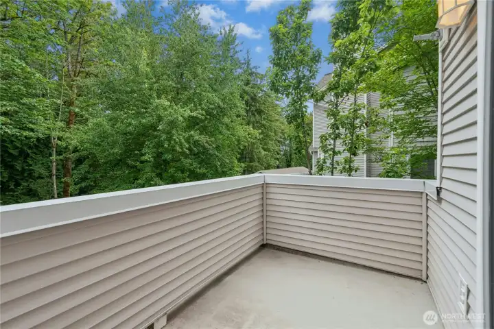 Alternate view of the rear deck with peaceful views of the surrounding trees. Alternate view of the rear deck with peaceful views of the surrounding trees.