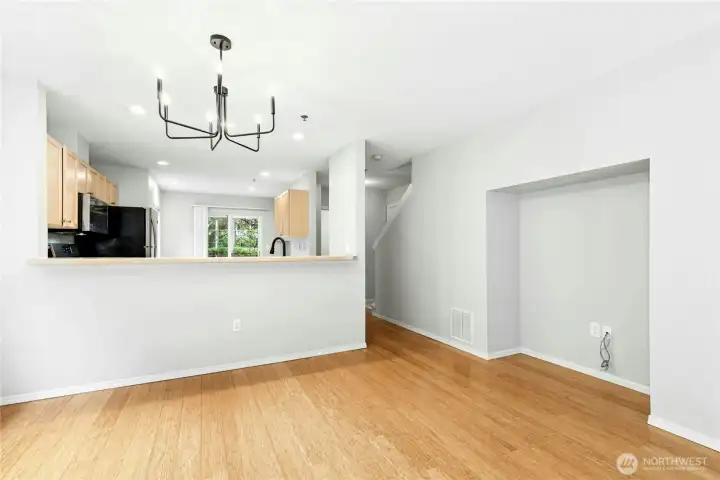 Open-concept main floor with connected living, dining, and kitchen spaces. Open-concept main floor with connected living, dining, and kitchen spaces.