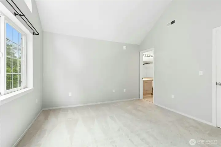 Alternate view of the spacious primary bedroom with ensuite bath and walk-in closet. Alternate view of the spacious primary bedroom with ensuite bath and walk-in closet.