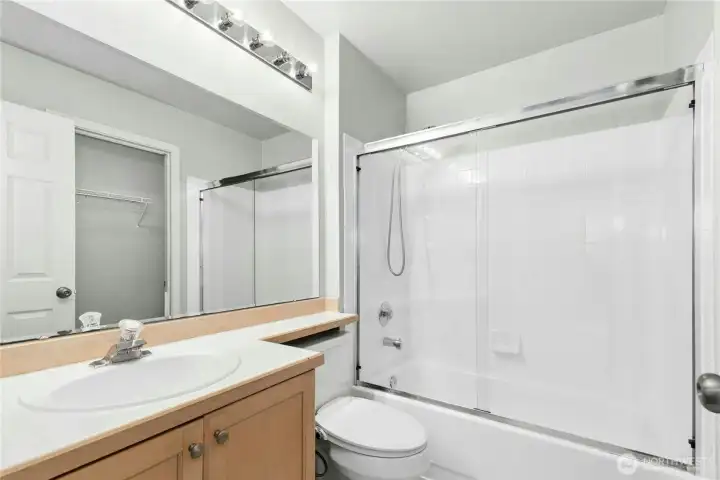 Primary ensuite bath with oversized vanity and tub/shower combination. Primary ensuite bath with oversized vanity and tub/shower combination.