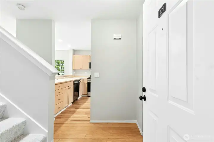 Entry foyer with staircase leading to the upper-level bedrooms. Entry foyer with staircase leading to the upper-level bedrooms.