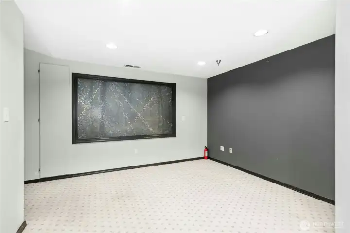 Alternate view of the finished lower-level flex space with abundant room for a variety of uses. Alternate view of the finished lower-level flex space with abundant room for a variety of uses.