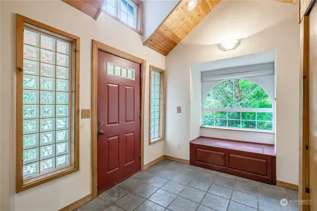 The entry acts as a mud room, the perfect spot to sit down and take off your shoes!