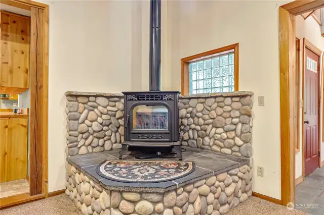 Check out the river-rock accented pellet stove. This thing can heat the whole house!