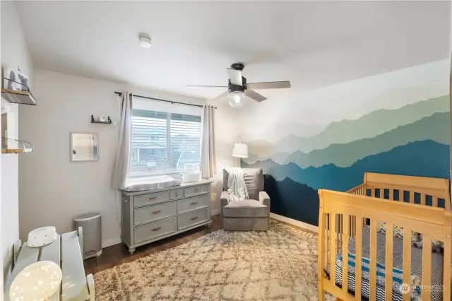 Second bedroom with custom mural