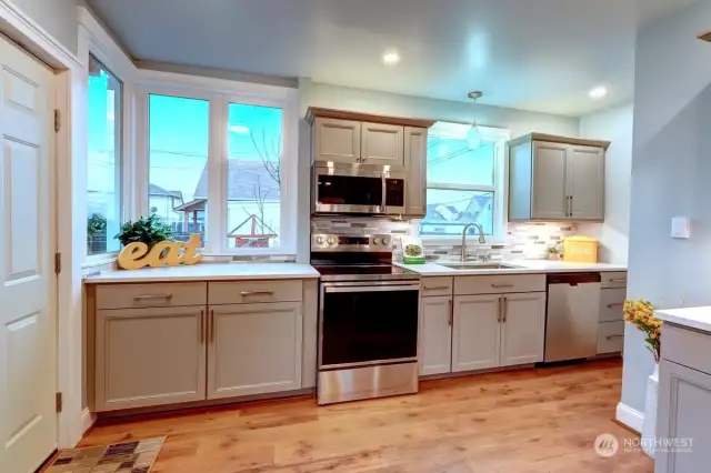 Great Updated Kitchen with wonderful wood wrapped windows to let in all the natural light.