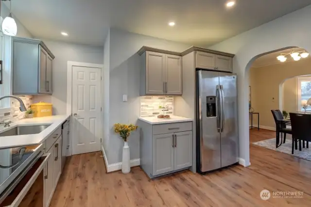 Updated Kitchen With Quartz Countertops, New Cabinetry, New Lighting & Appliances.