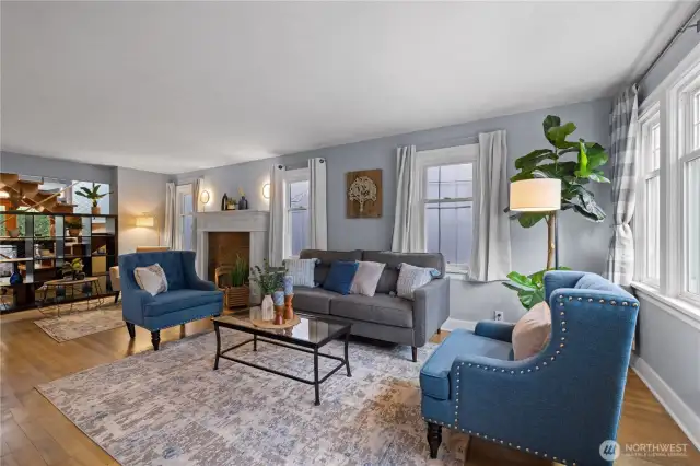 Beautiful Entry and Formal Living Room.  Beautiful Original Flooring, Fireplace, Open to Stairway and Dining Room.
