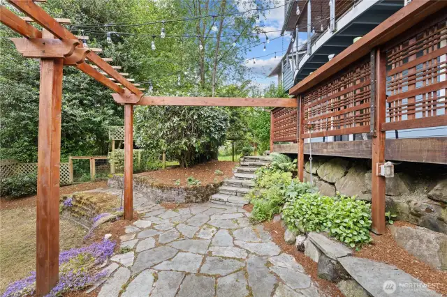 Flagstone patio and wood arbors.