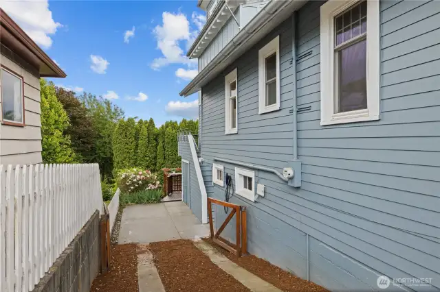 Side Driveway with EV charger or space to park extra vehicles.