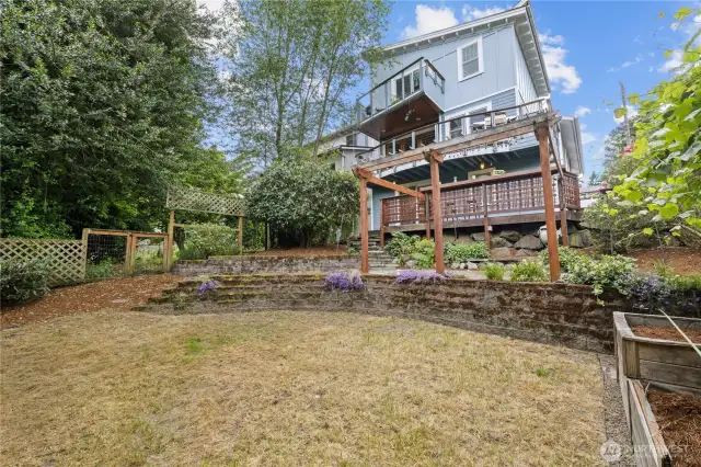 Large protected back yard ready for your creative gardening plans.