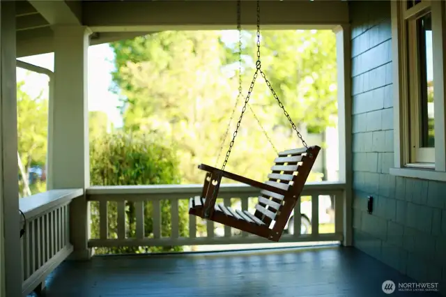 A porch swing that practically demands a good book and your morning coffee.