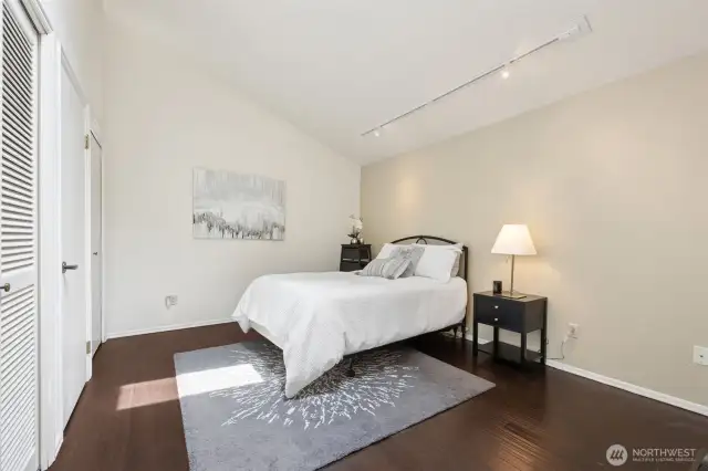 Track lighting and a skylight brighten this room. Throuoghout this home you wil love the gallery walls beckoning your art displays.