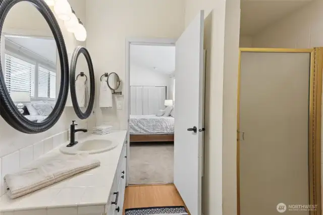 You are ins the bathroom with the shower stall to the right.