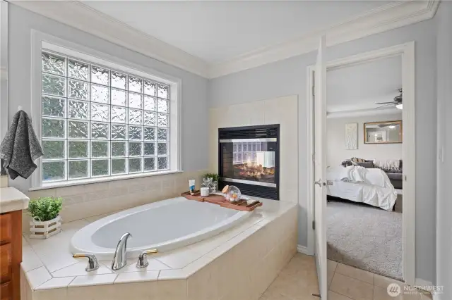 Enjoy a deep soak in the amazing tub perfectly situated in front of the gas fireplace