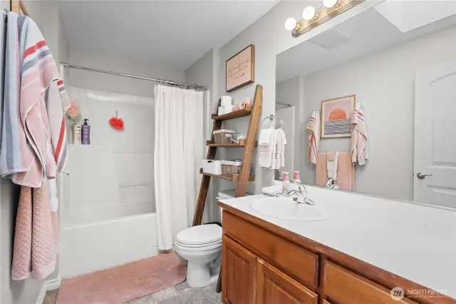 One of three upstairs full baths