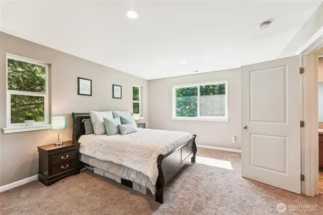 Primary suite overlooks expansive back yard