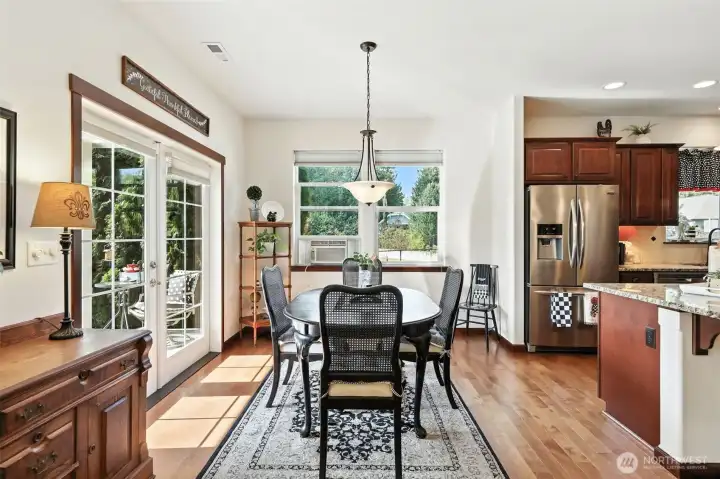 Dining Area with French doors that lead you to the outdoor covered back patio and yard
