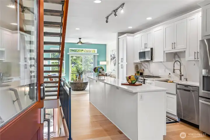 From the front door you get a great view of the updated kitchen, the beautiful new engineered hardwood floors, the striking floating staircase and the overall connectivity between floors.