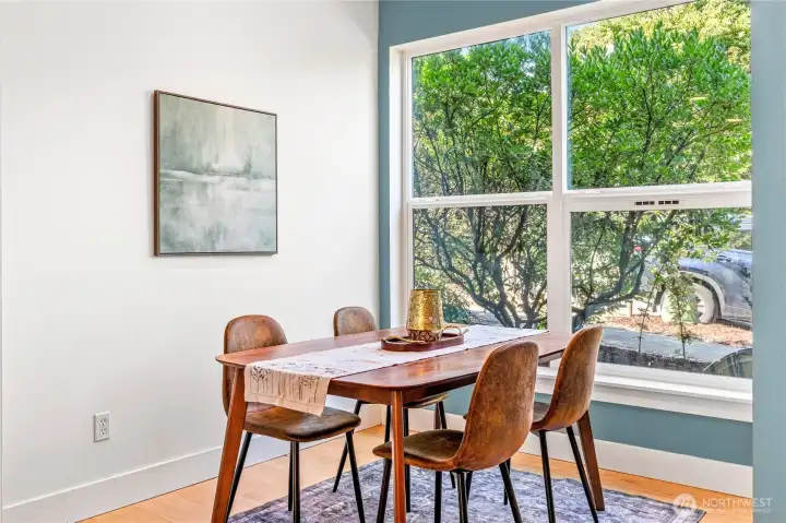 This dining area can fit a much larger table and is flooded with natural light. Cute little patio out front beckons you to sit with your coffee and relax before you start your day!