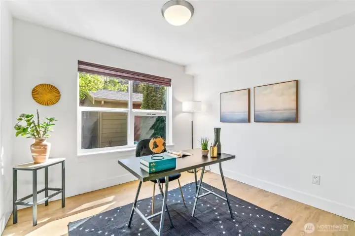 This daylight lower level has it all—whether you need a third bedroom, a quiet office, or just a place to retreat. Durable LVP flooring runs throughout (including on the stairs), leading to a practical full bath, laundry, and direct access to the back patio and garage.