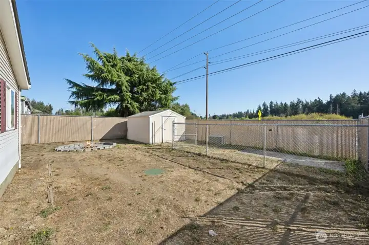 Large backyard with fenced in dog area